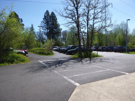 Asphalt parking lot with transition to concrete plaza - crosswalk